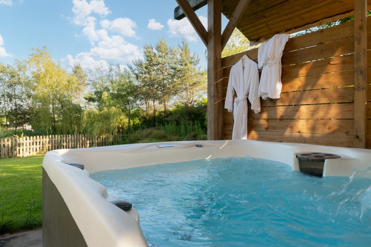 Large, covered hot tub with countryside views
